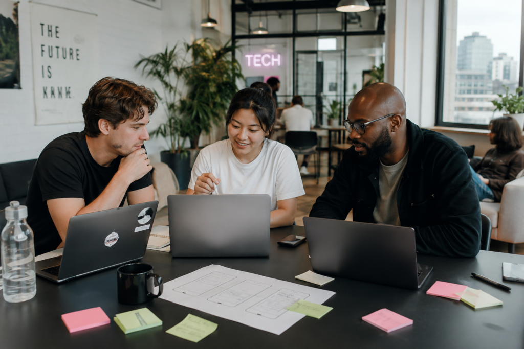 Startup team working on mobile app idea in co-working space